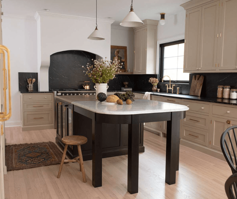 A kitchen with an island and wooden floors